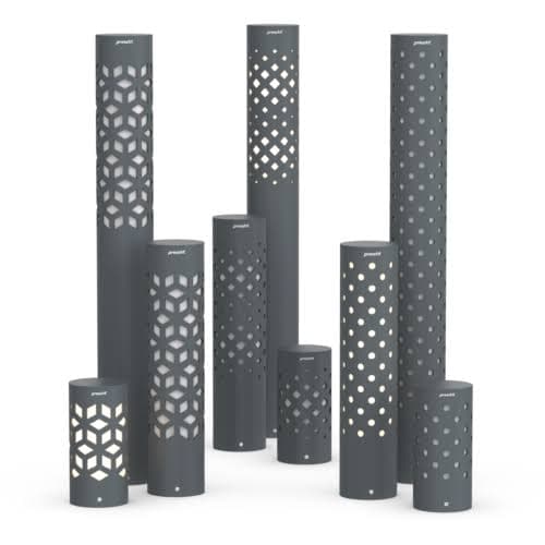 A cluster of grey powder-coated column bollards with laser-cut geometric patterns glowing warm from within, on a white field